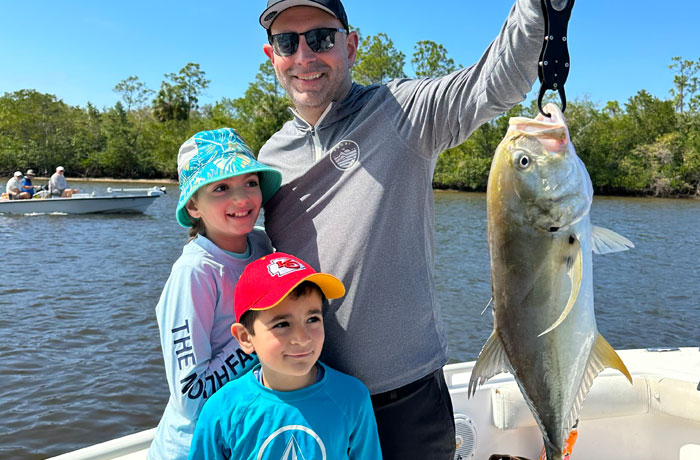 Dad & kids catch fish